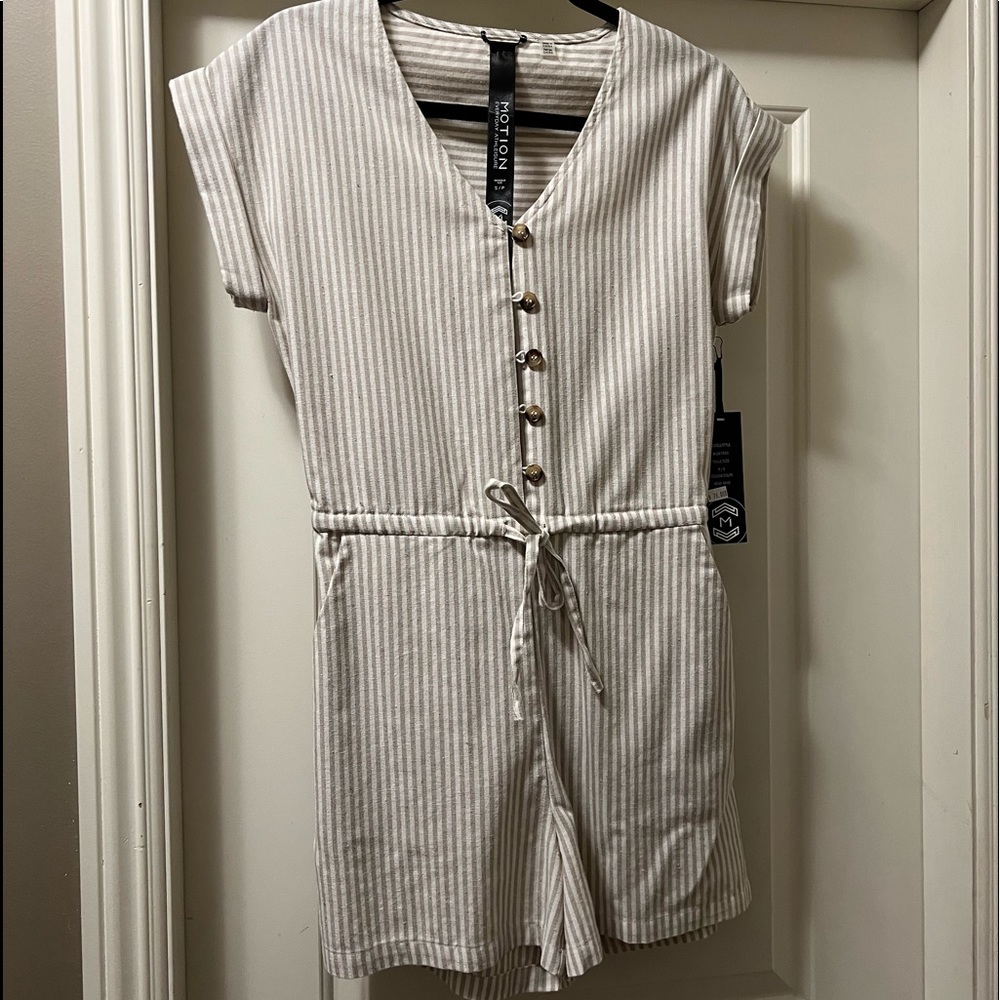 Beige and white striped short romper.